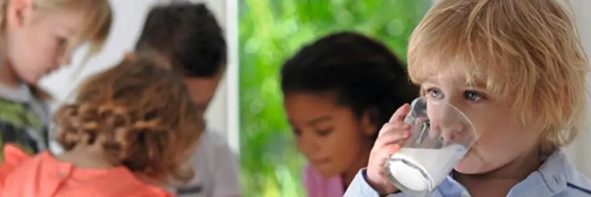 small-boy-is-drinking-milk-from-a-glass-cup