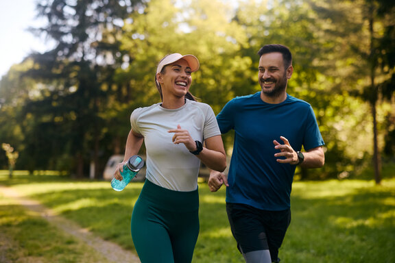 couple is jogging in nature