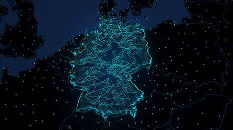 A digital map of Germany highlighted with glowing, interconnected lines and nodes, symbolizing a network or technological infrastructure within the country