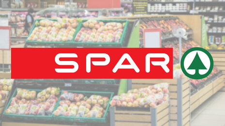 Logo copyright Spar Slovenija. spar logo in a blurried grocery store