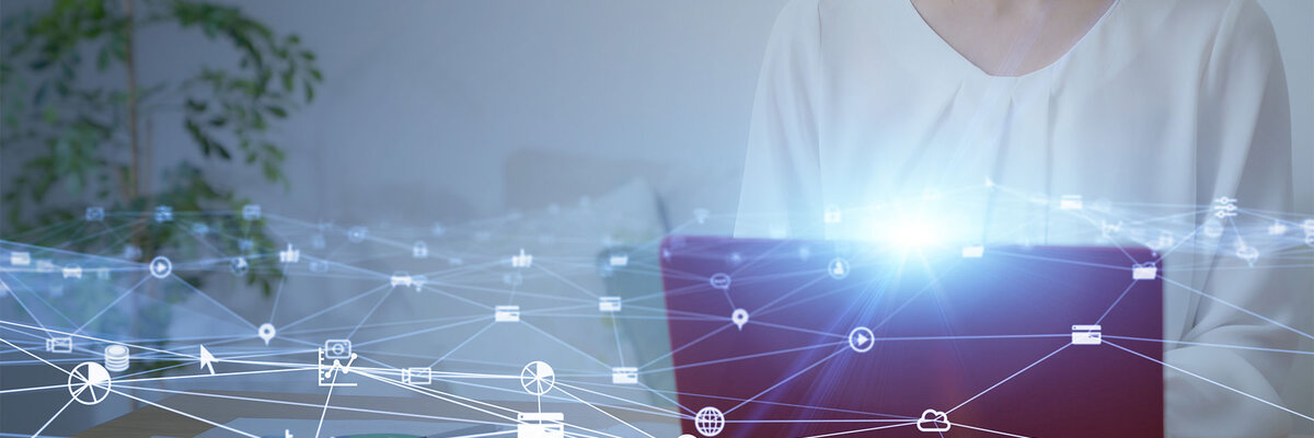 Woman working on a laptop with digital network icons and connections overlayed