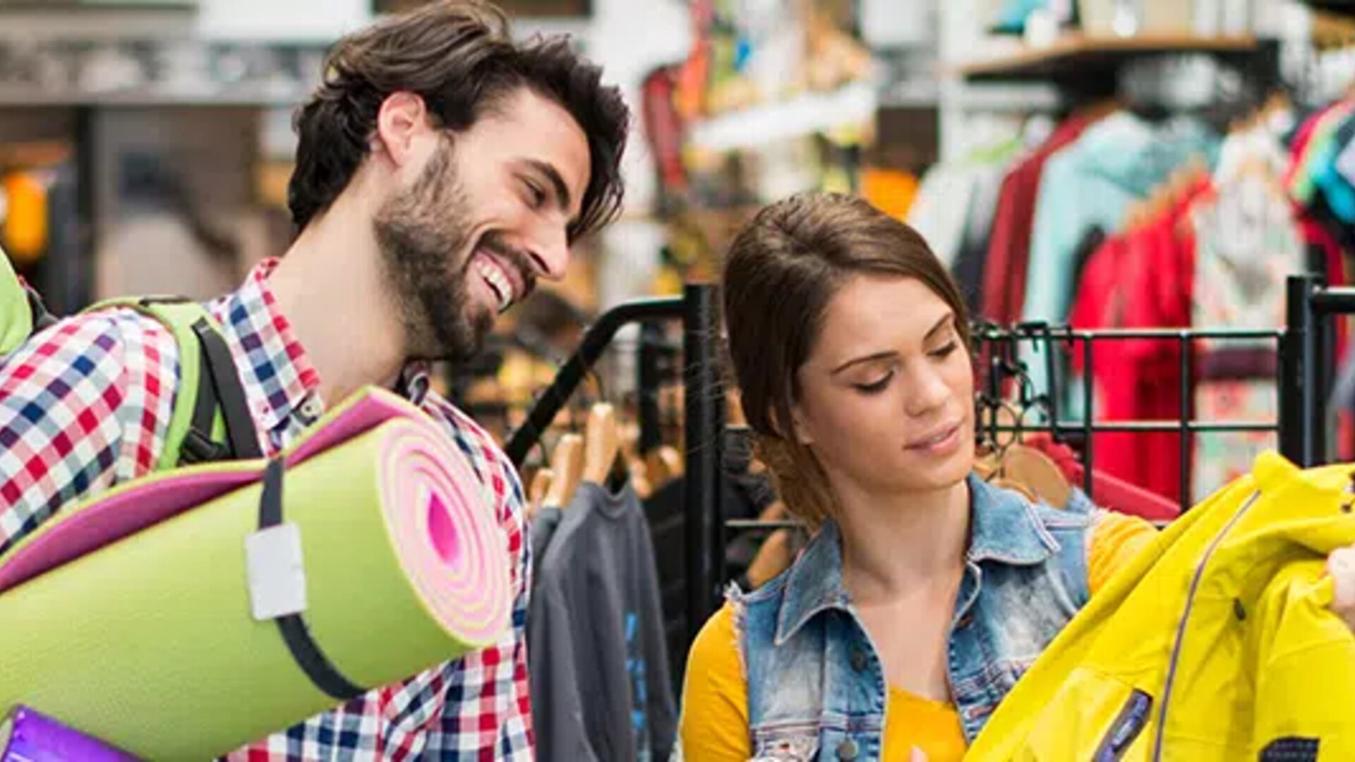 Man and woman shopping in a sports shop - symbolises the process behind where EDI for Sport 2000 comes into play.