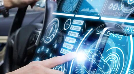 man-in-a-car-pressing-a-button-digitalization