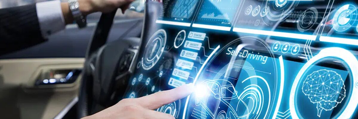 man-in-a-car-pressing-a-button - Alpine Electronics digitalization