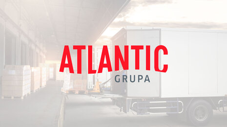 Logo copyright www.atlanticgrupa.com Atlantic group logo on a truck loading dock background