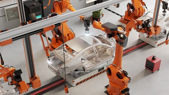 Robotic arms assembling a car frame in an automated factory, showcasing modern manufacturing technology