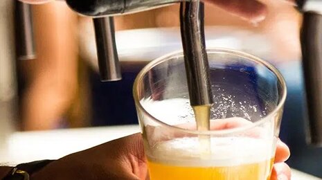 Pouring beer in a glass