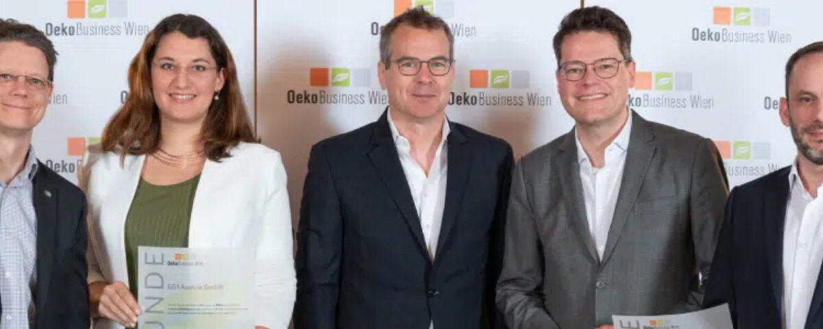 OekoBusiness winners posing in front of promo wall