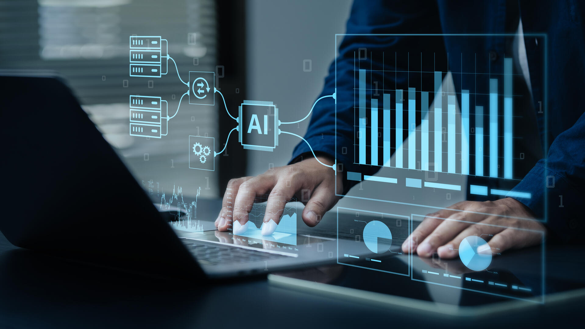 Business professional using a laptop with digital charts and connected application icons displayed on the screen.