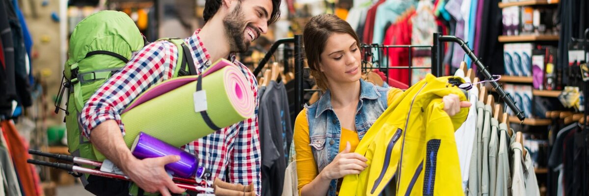 Man and woman shopping in a sports shop - symbolises the process behind where EDI for Sport 2000 comes into play.